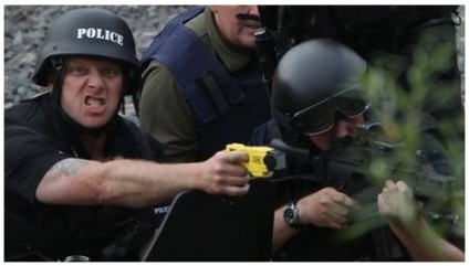"Yes, I know he's got a shotgun, but check it out: I've got a taser and an angry face!"